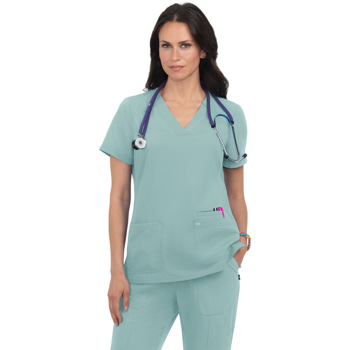 KOI Next Gen Women's 3-Pocket Wide V-Neck Stretch Hustle and Heart Top